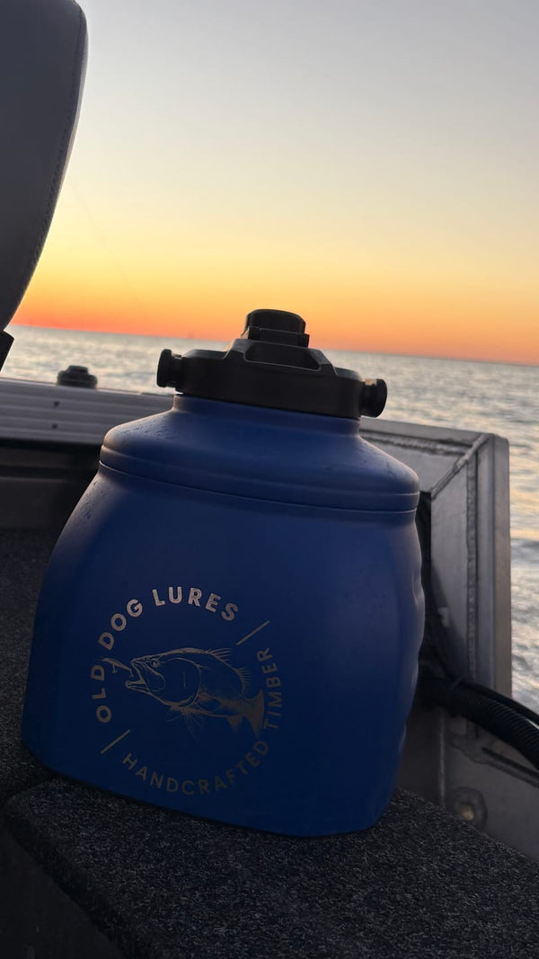 Customer photo: engraved blue 6L Yowy on a boat at sunset